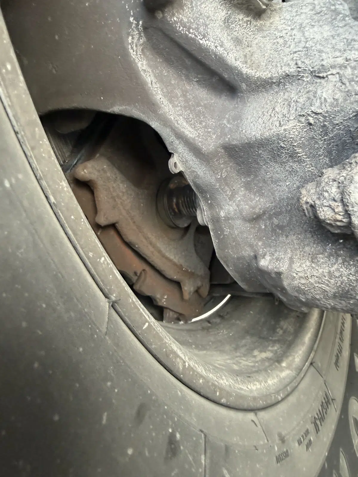 Close-up of a brake assembly behind a truck wheel — Rickey Alexander Mobile Truck & Trailer Repair in Forrest City