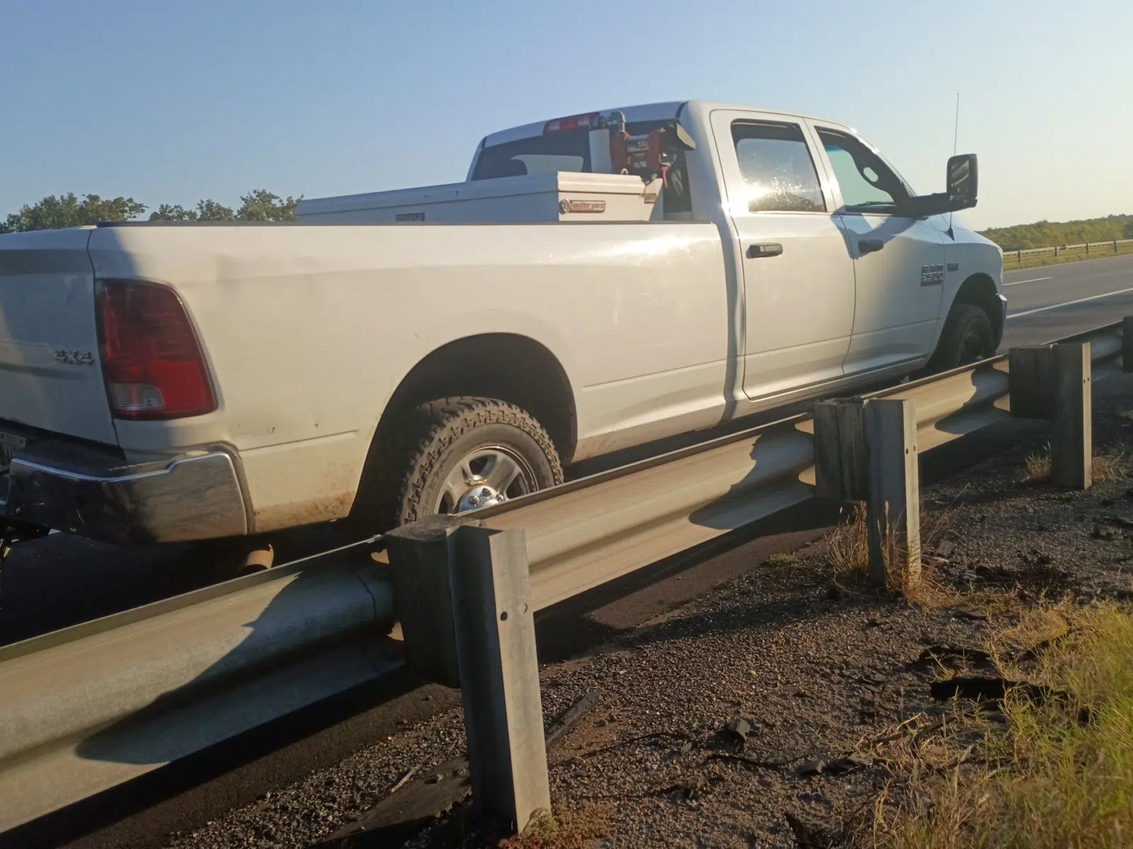 White service pickup parked along a rural highway shoulder — Rickey Alexander Mobile Truck & Trailer Repair in Forrest City